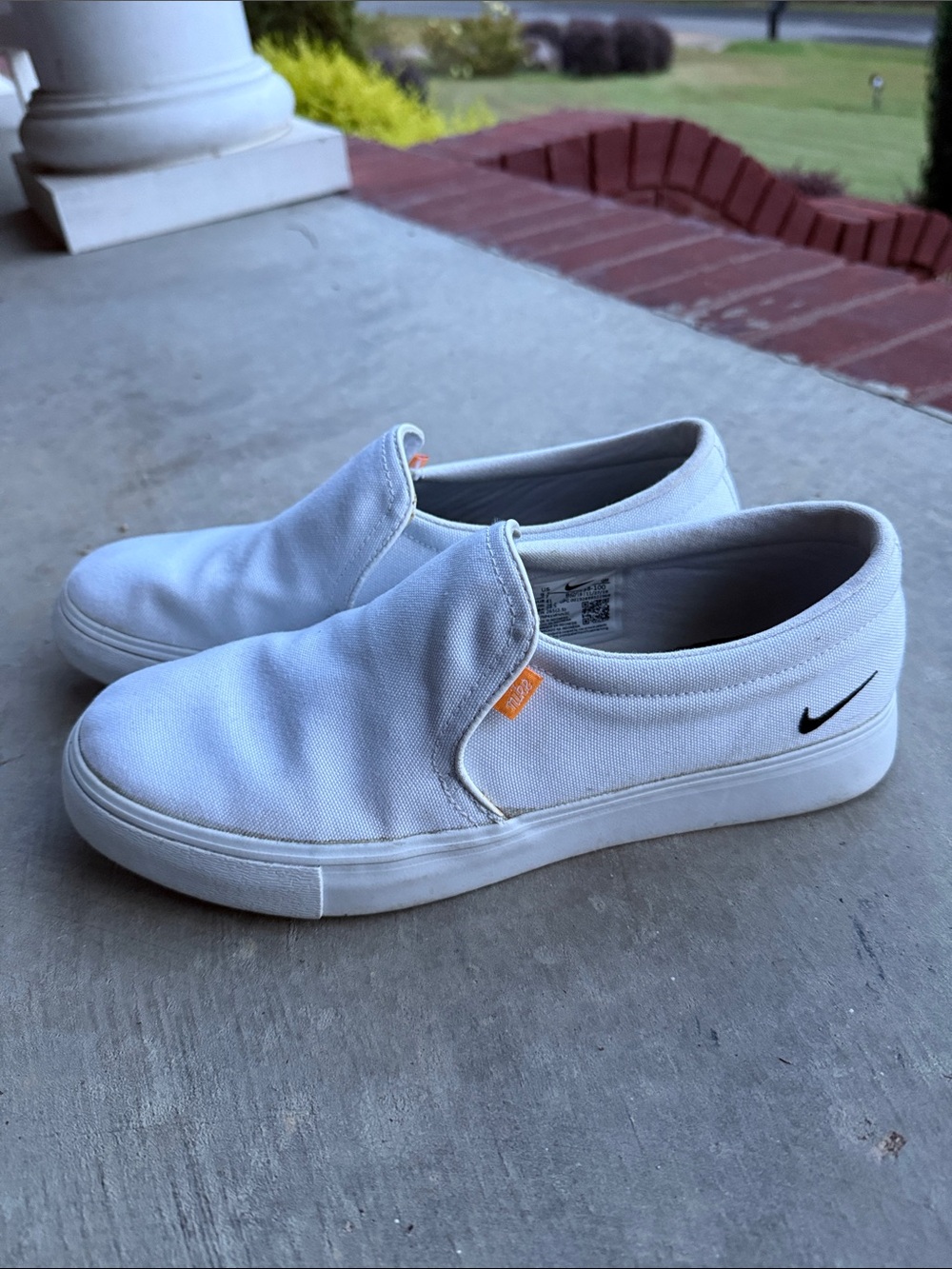 Nike White Canvas Slip-On Loafers with Black Swoosh